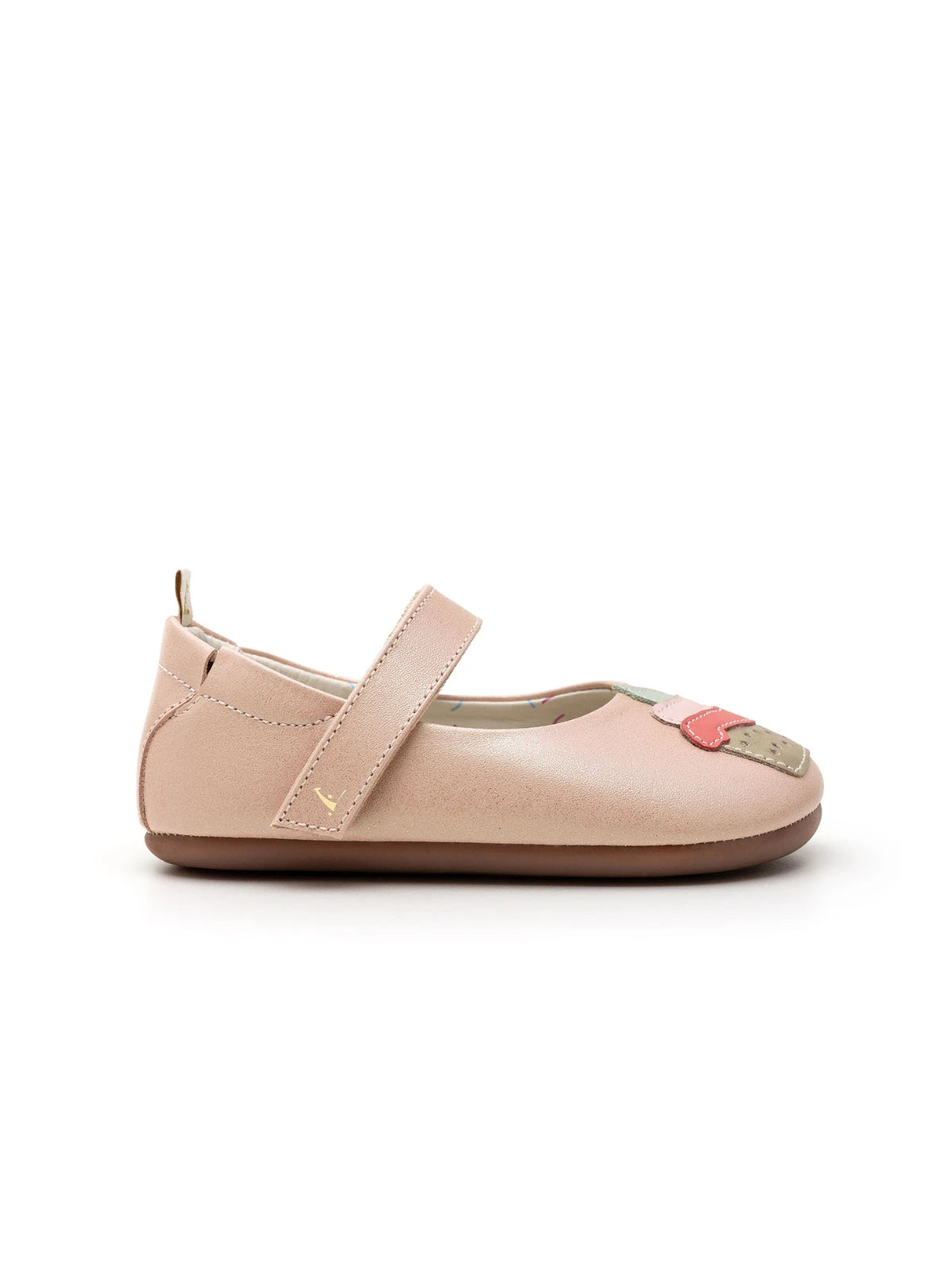 Side view of a blush pink leather baby Mary Jane shoe showing the low profile and flat sole design.