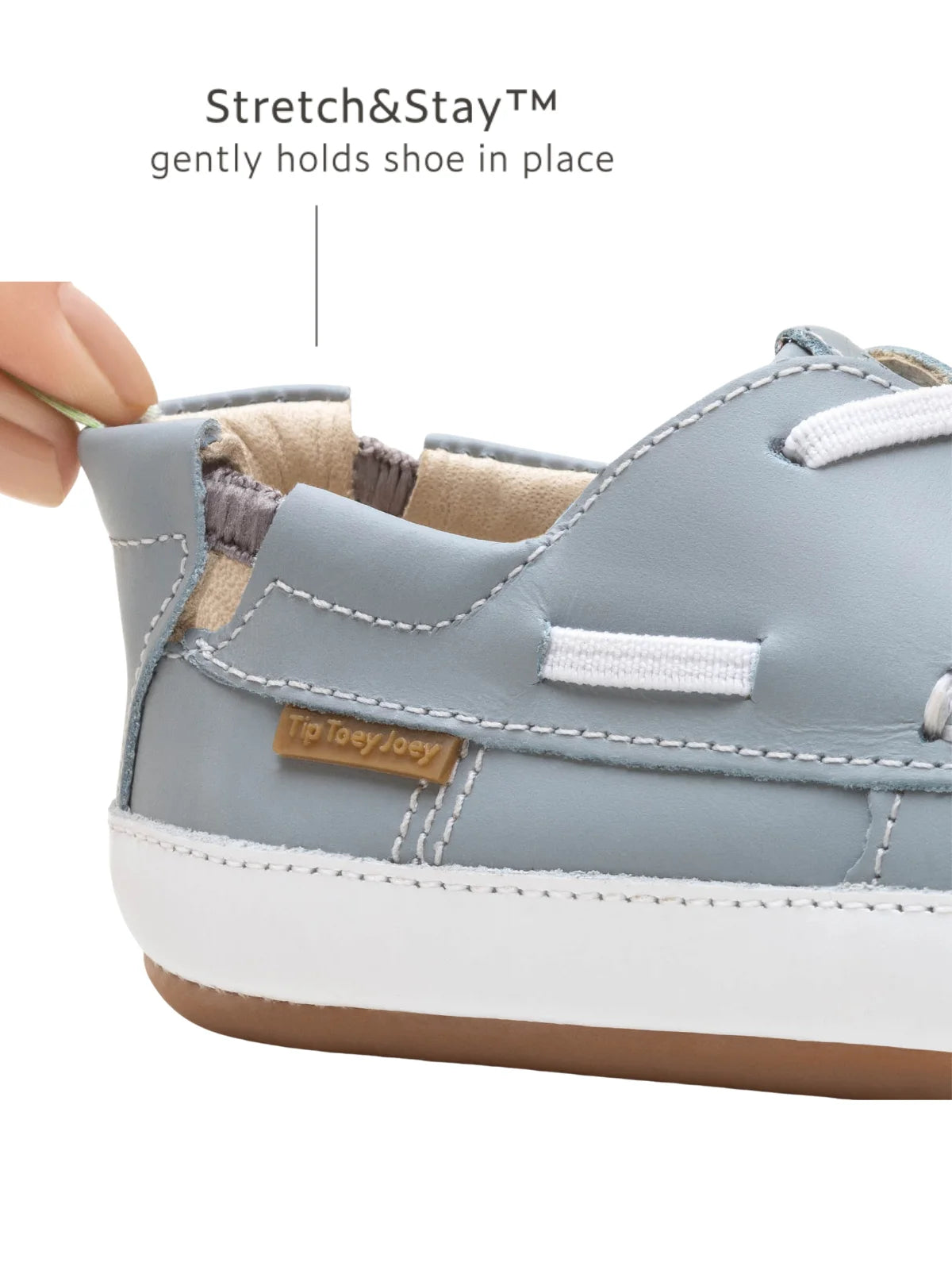 Close-up of the Stretch & Stay elastic heel on the Tide Blue baby shoe for a secure and comfortable fit.