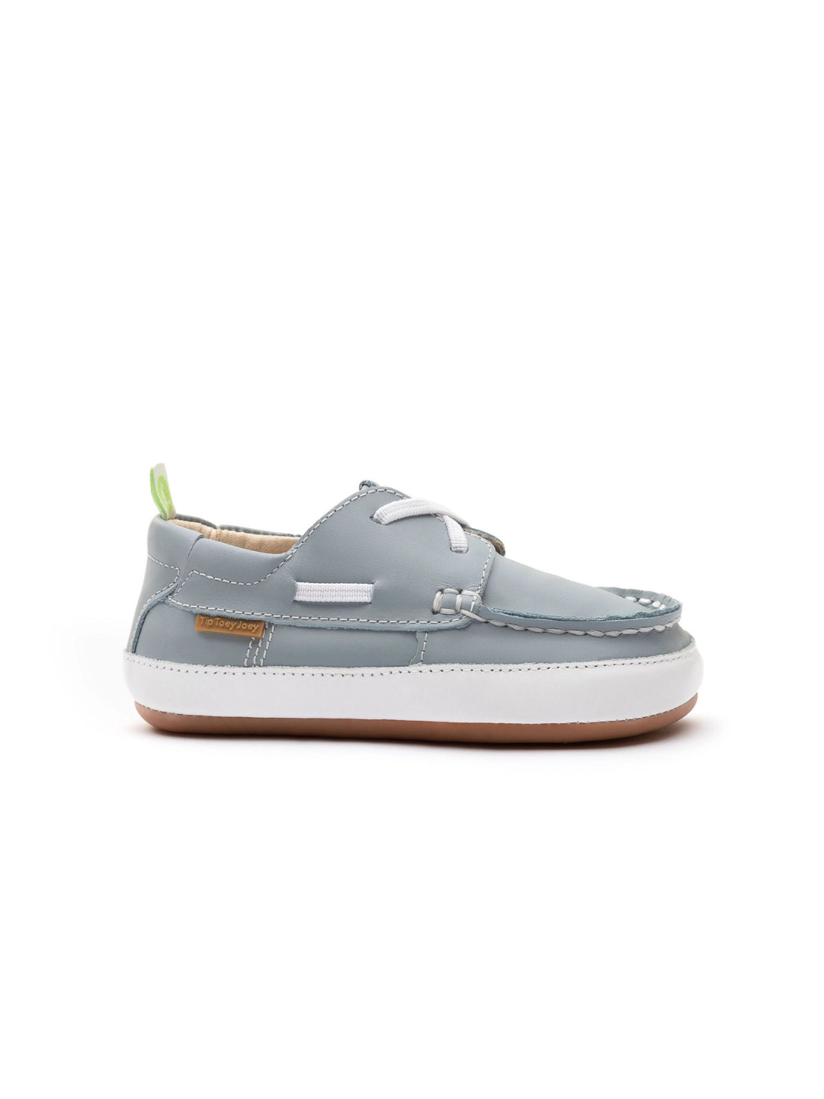 Side profile of the baby Tide Blue loafer showing the slim ergonomic flat sole and boat shoe silhouette.