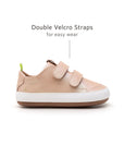 Side profile of the baby candy dream sneaker showing the adjustable white velcro straps and leather finish.