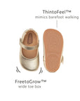 Product diagram showing the champagne Mary Jane's wide toe box and ThinToFeel sole designed for healthy barefoot foot development.