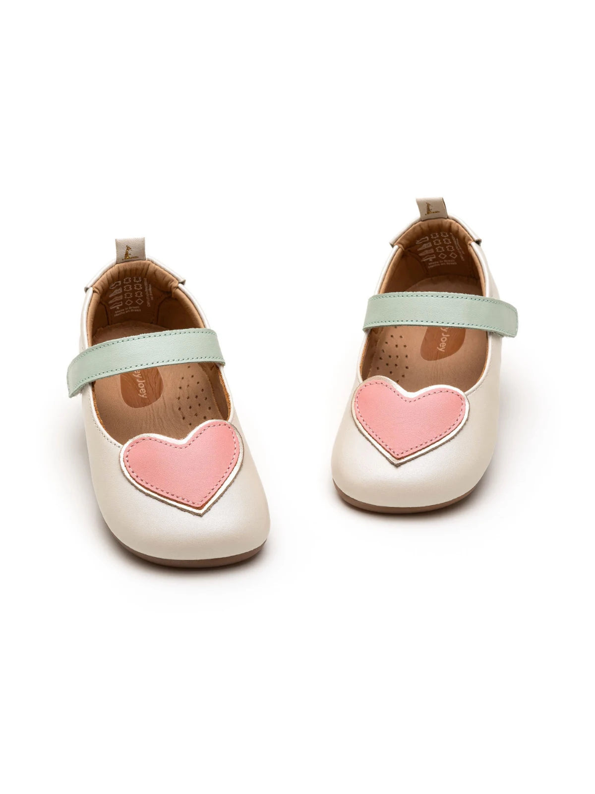 Pair of antique white Mary Janes with mint green straps and pink hearts, showcasing the lightweight, flexible construction.