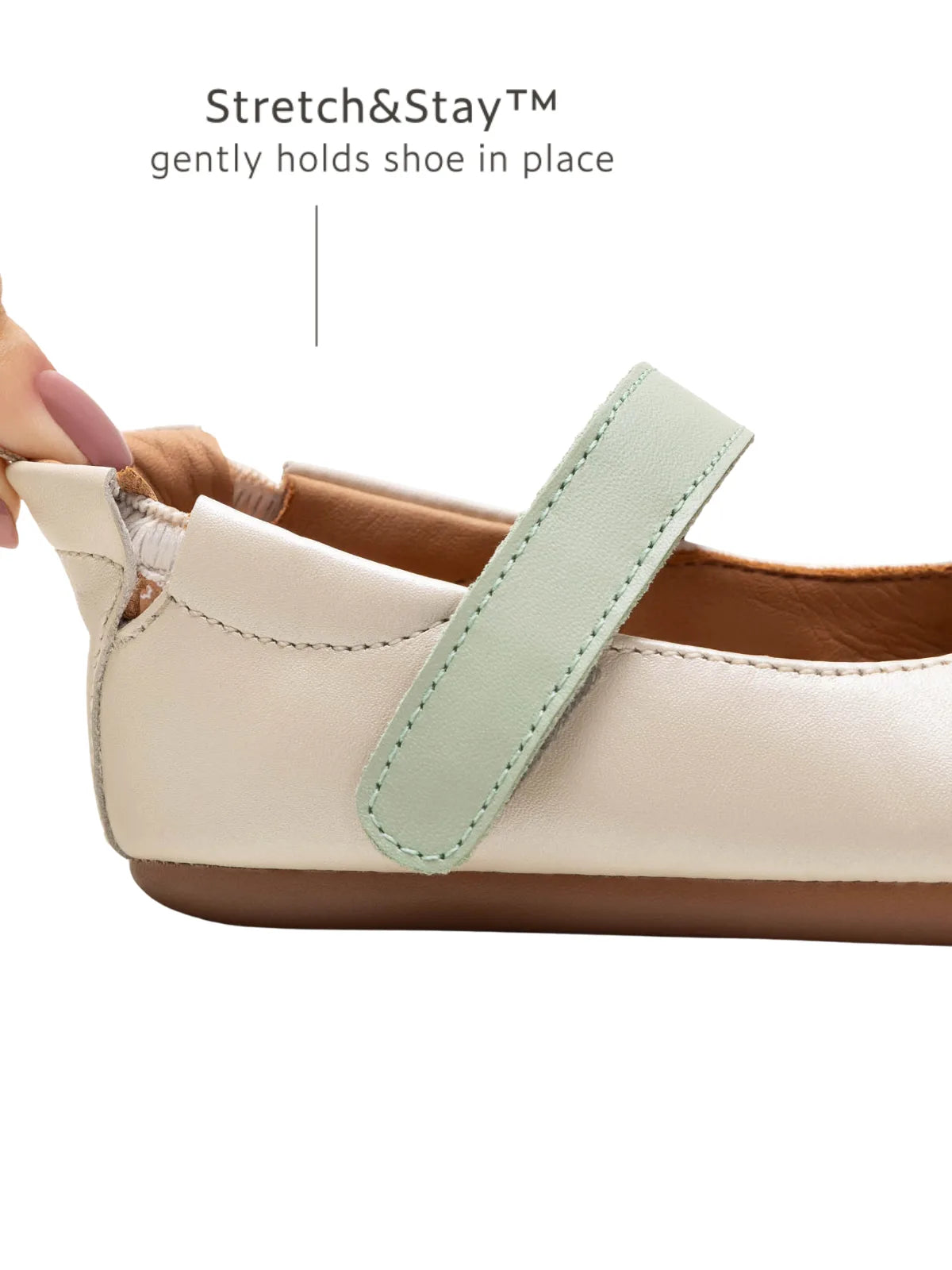 Close-up of the Stretch and Stay elastic heel on the antique white Mary Jane for a secure, comfortable fit on baby feet.