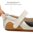 Close-up of the Stretch & Stay elastic heel on the baby kitten shoe, ensuring a secure and easy fit for infants.