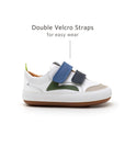 Side view of the Landy baby sneaker featuring double velcro straps for easy on-and-off and a secure infant fit.