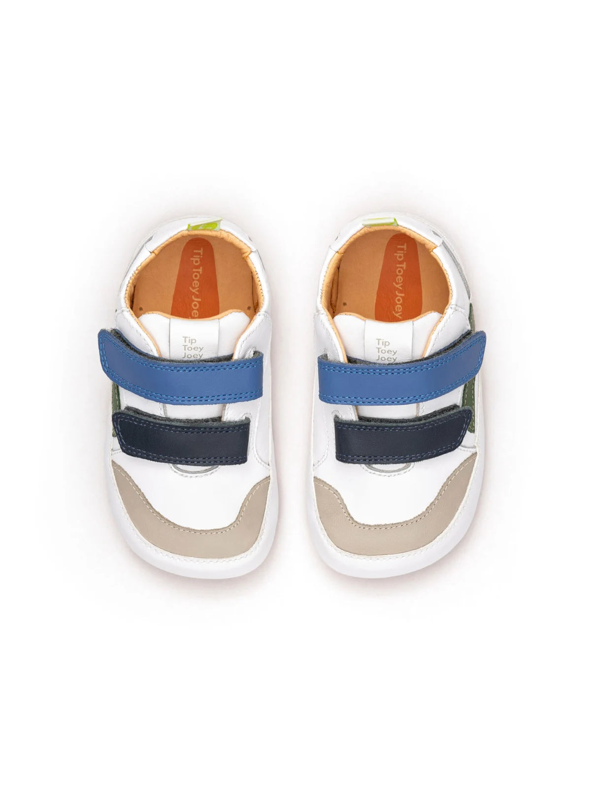 Overhead view of the white and blue tang baby sneakers, highlighting the adjustable double velcro straps for a custom fit.