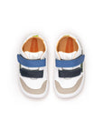 Overhead view of the white and blue tang baby sneakers, highlighting the adjustable double velcro straps for a custom fit.