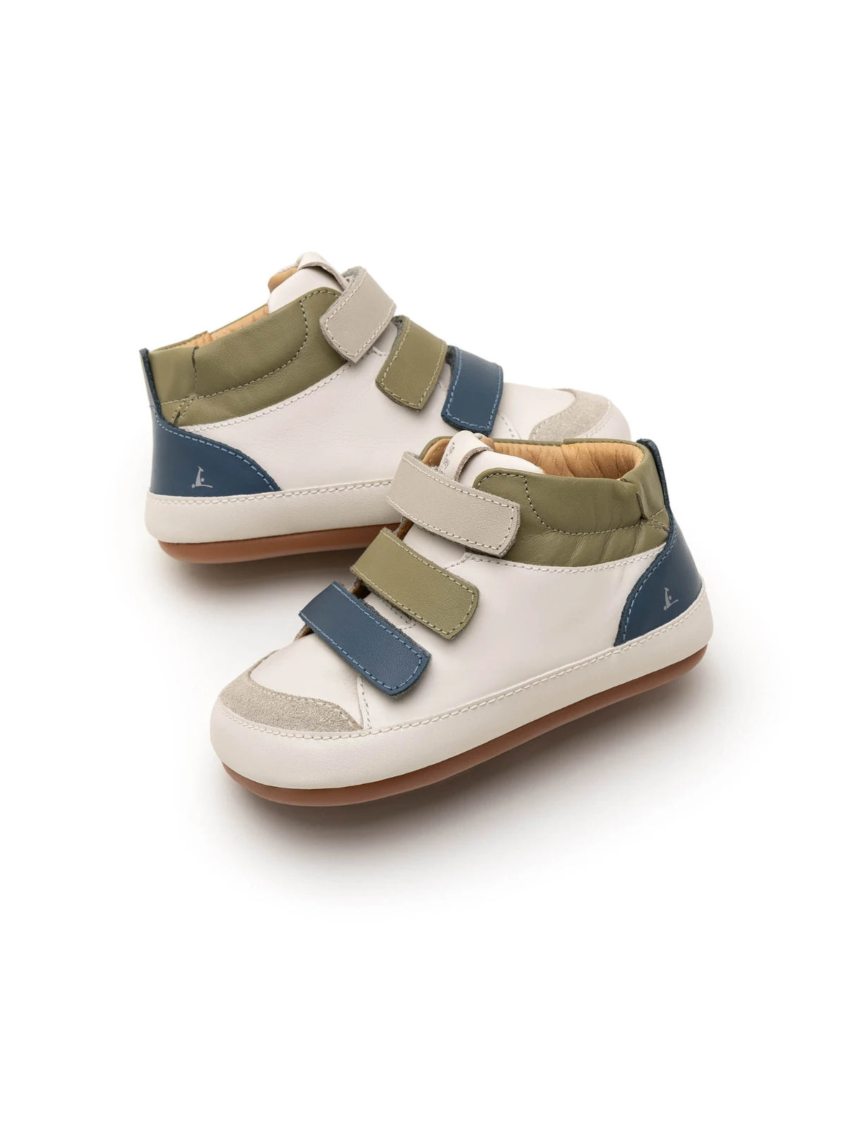 Angled view of baby Metropoly sneakers showing the triple-strap closure and premium leather panels.