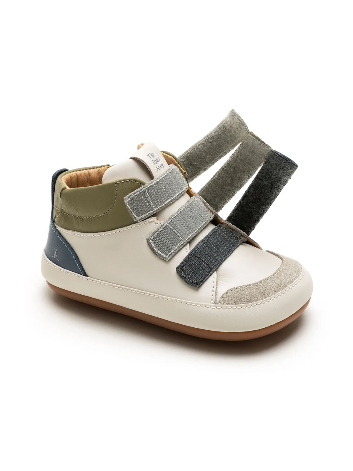 Front angled view of the tapioca baby sneaker showing the adjustable laguna and olive green straps.