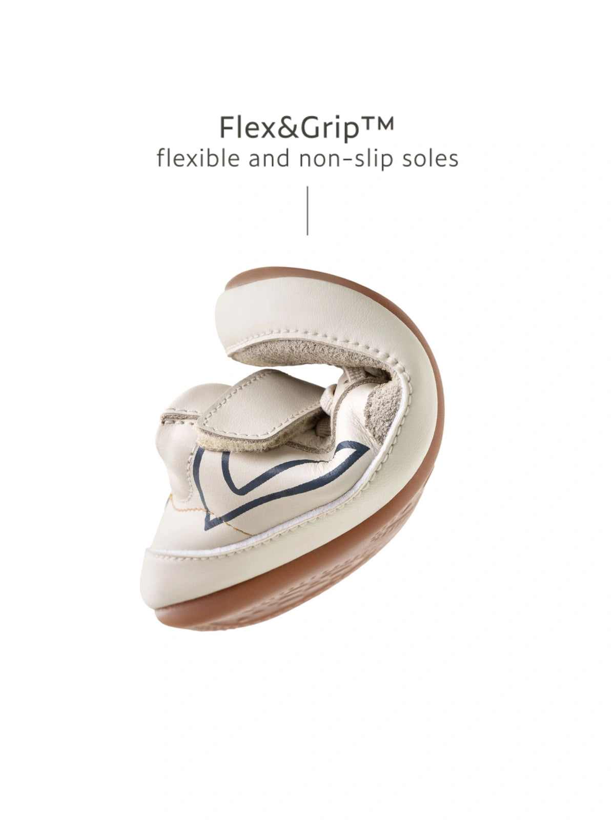 Demonstrating the flexible FlexiGrip rubber sole on the baby Outline sneaker for natural foot movement.