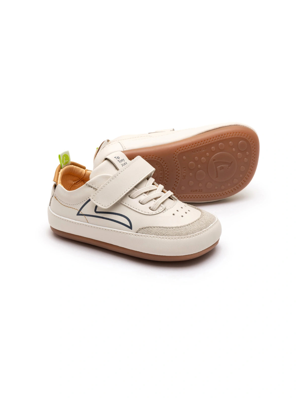 Baby Outline sneakers in tapioca leather and ivory suede with a hay yellow velcro strap and rubber sole.