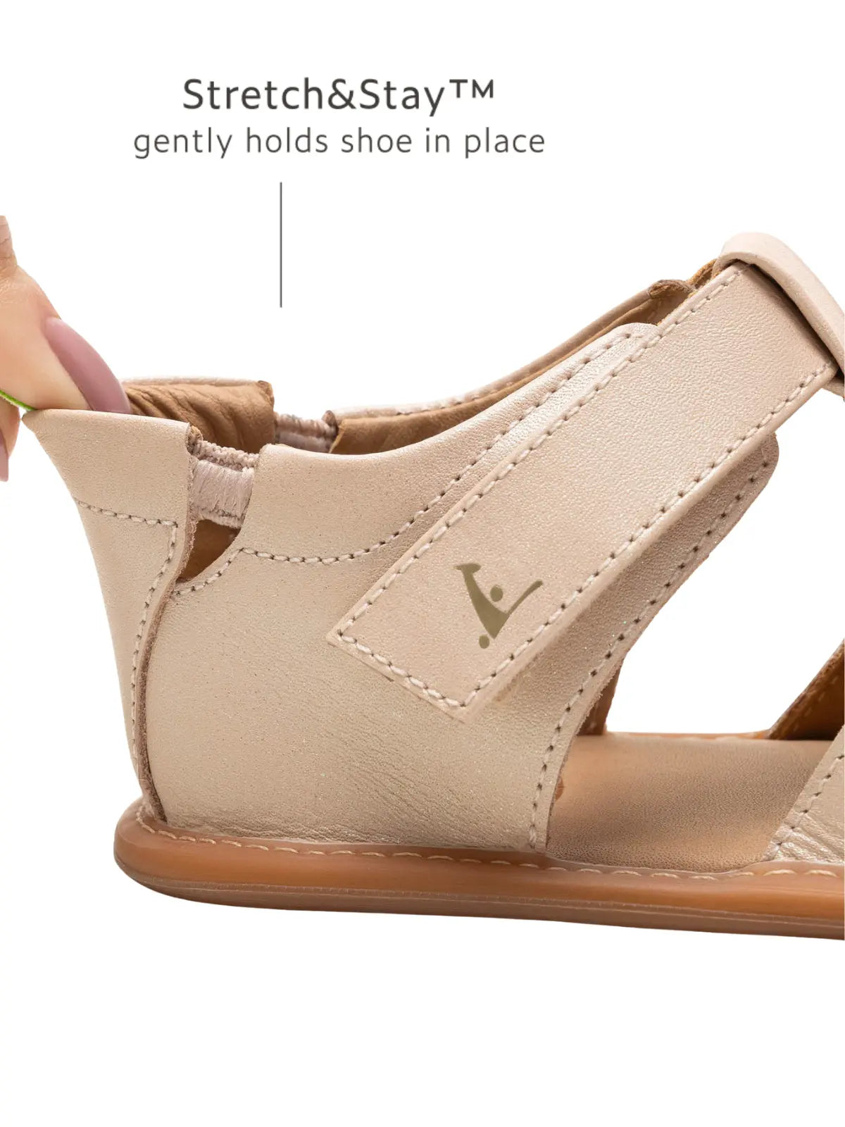 Close-up of the Stretch & Stay elastic heel on the pink leather baby sandal for a secure, easy-on fit.