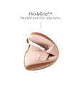 Demonstrating the flexible FlexiGrip sole on the pink leather baby shoe for natural movement and balance.