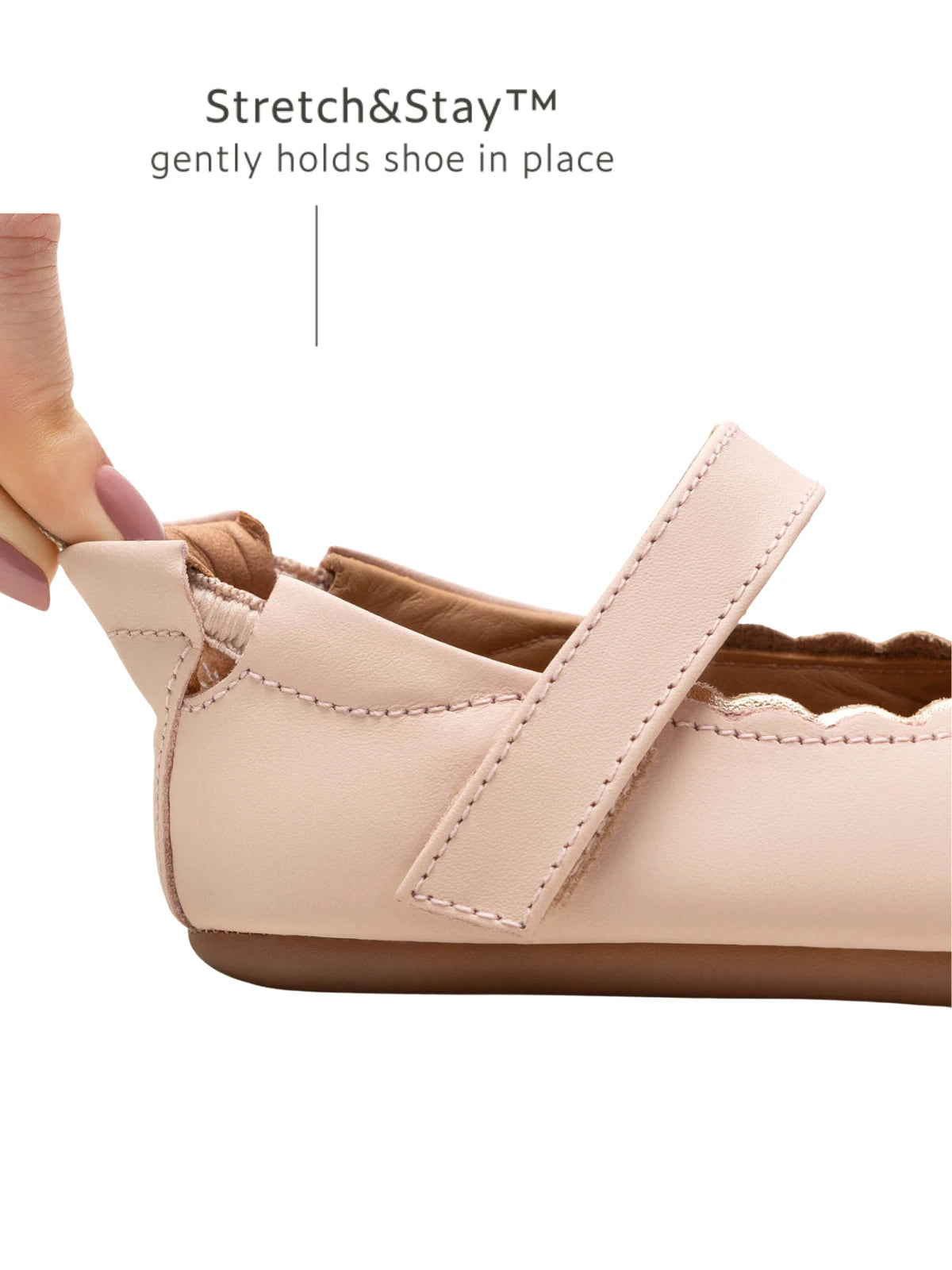 Close-up of the Stretch & Stay elastic heel on the pink baby shoe, ensuring a snug fit that stays on.
