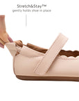 Close-up of the Stretch & Stay elastic heel on the pink baby shoe, ensuring a snug fit that stays on.