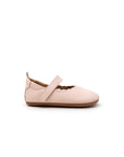 Side profile of the baby Roundy shoe in pink leather, highlighting the slim, flexible rubber flat sole.