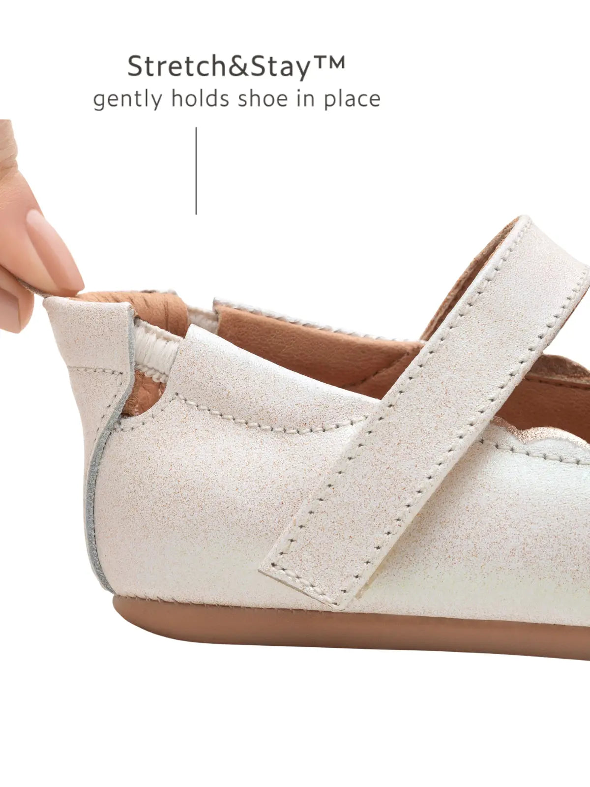 Close-up of the Stretch & Stay elastic heel on the white dream baby shoe, ensuring it stays on tiny feet.
