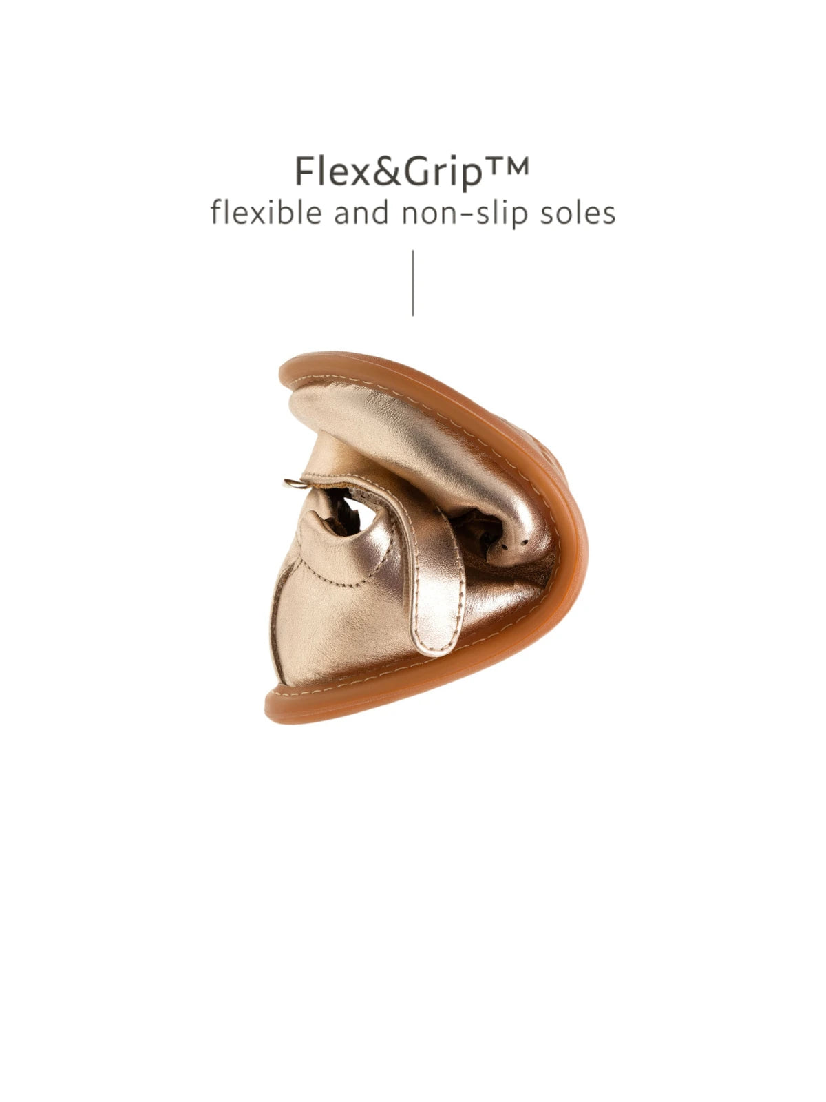 Showing the flexible Flex & Grip sole on the metallic salmon baby shoe to support natural foot development.