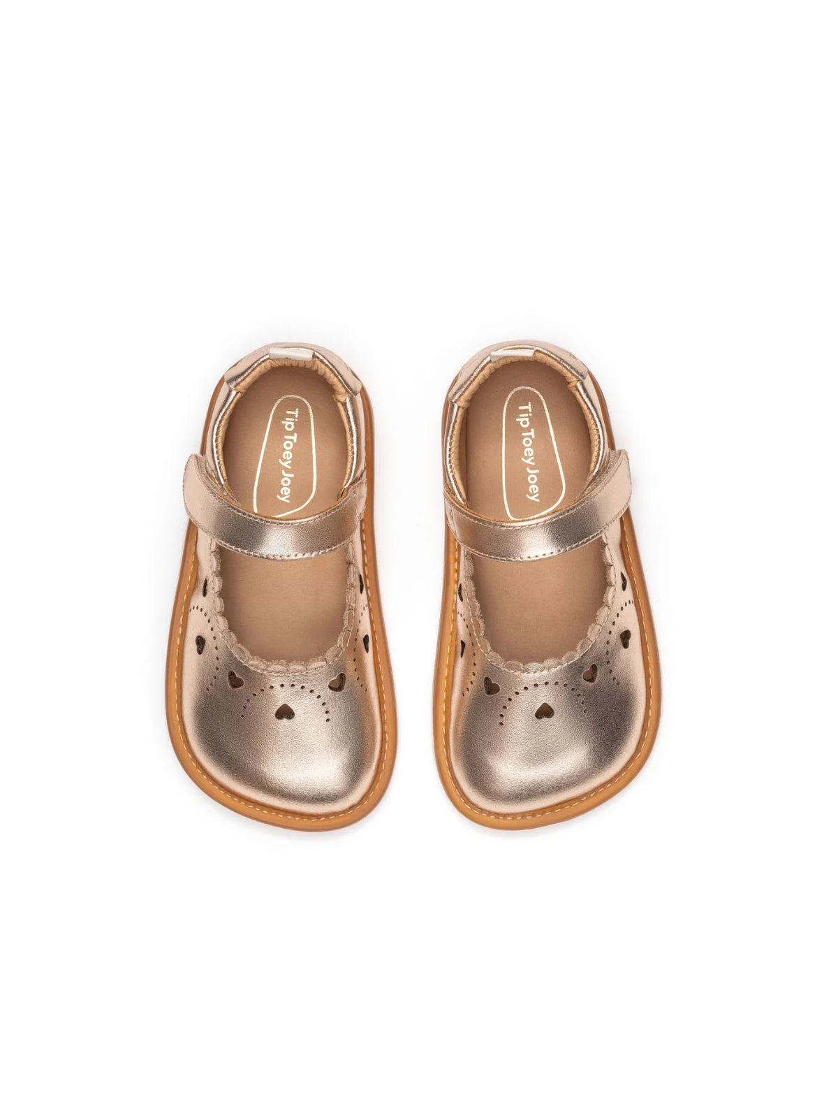 Overhead view of the metallic salmon baby shoes highlighting the wide toe box and heart-shaped laser cut-outs.