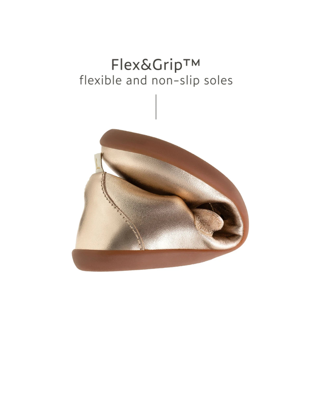 Demonstrating the flexible Flex & Grip sole on the kids metallic salmon Mary Jane for natural movement.