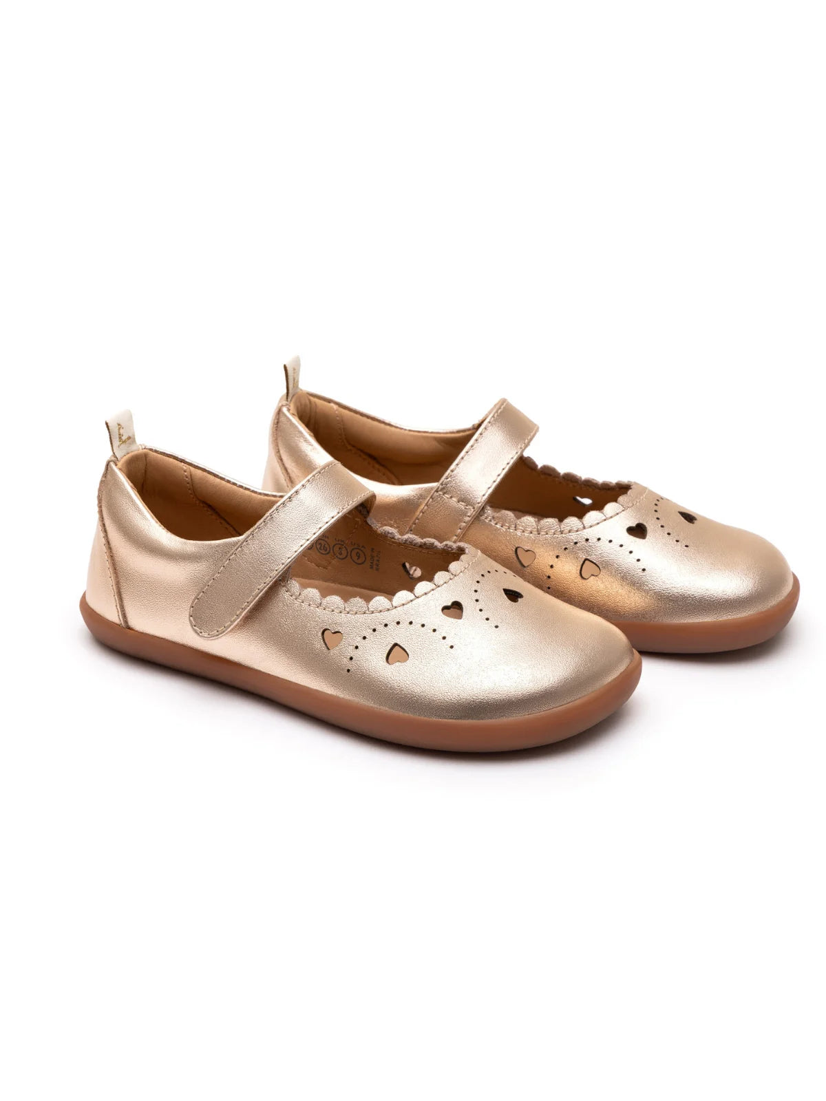 Kids metallic salmon leather Mary Jane shoes with heart cut-outs and a flexible flat rubber sole.