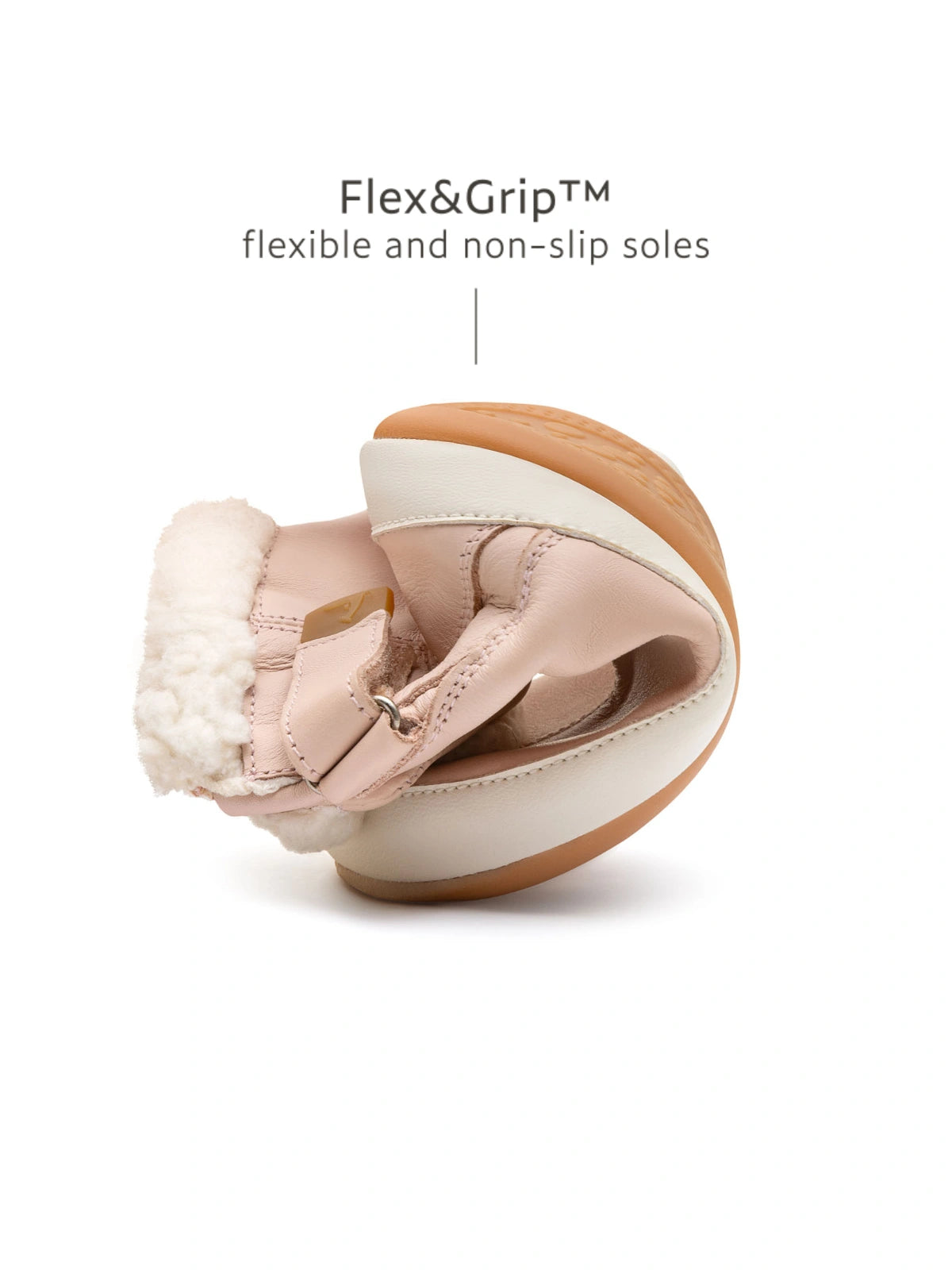 Demonstrating the flexible FlexiGrip rubber sole on the candy dream pink leather baby winter boot.