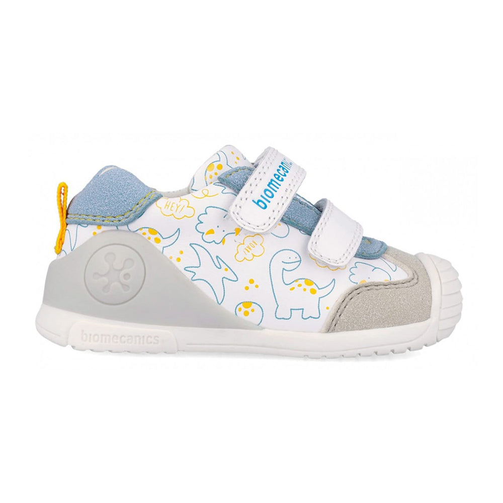Children's shoe with dinosaur design on a white background