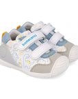 Children's shoe with dinosaur design on a white background