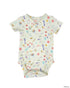 A baby short-sleeve bodysuit with a white background and a colorful Disney Princess-themed print, featuring illustrations of a castle, tiara, wand, and other royal motifs.