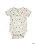 A baby short-sleeve bodysuit with a white background and a colorful Disney Princess-themed print, featuring illustrations of a castle, tiara, wand, and other royal motifs.