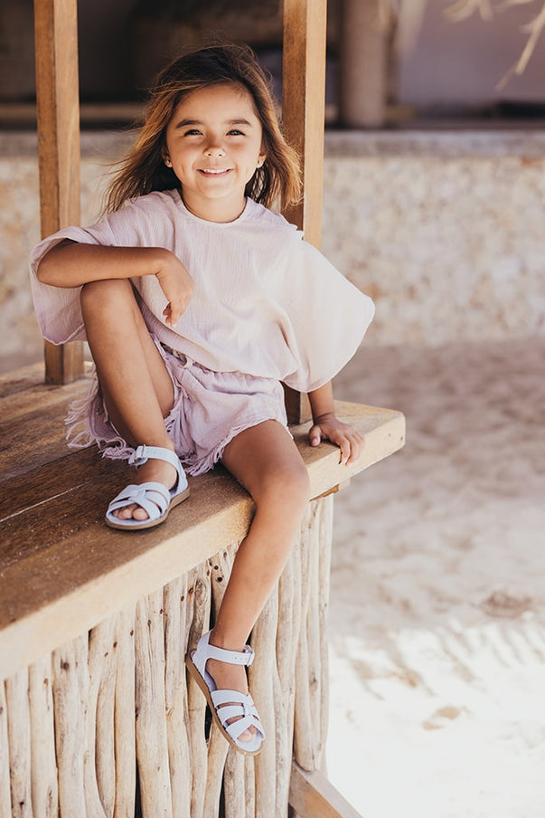 Beach club Sophie in pale blue outfit