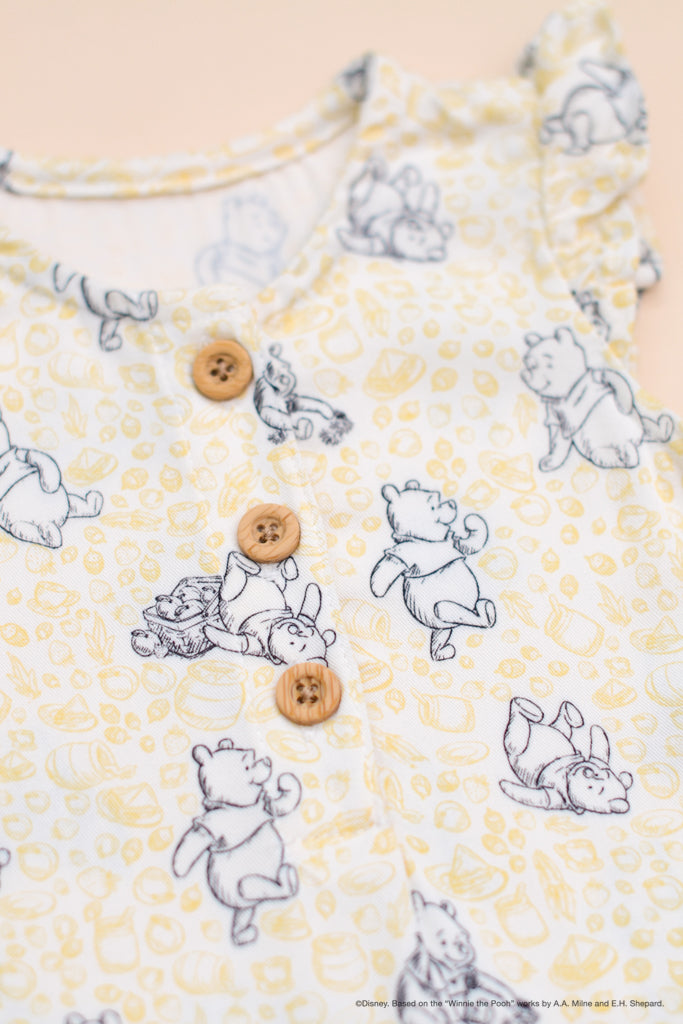 Caitlyn Romper Yellow Hunny Pooh buttons