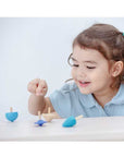 Plan Toys - Mini Spinning Tops (Playing)