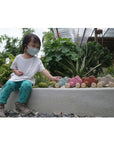 Plan Toys - Push Along Bunny Pink (Playing Front View))