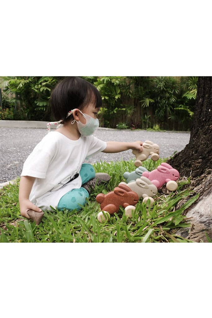 Plan Toys - Push Along Bunny Pink (Playing Side View)