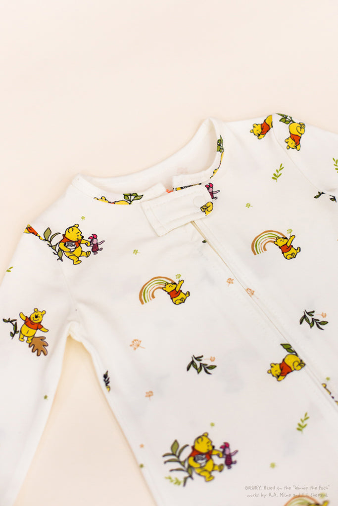 Sleepsuit - White Rainbow Pooh | Disney x elly | Baby Essentials at The Elly Store Singapore